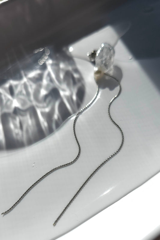 KAKERA drop earring inspired by natural rock fragments, with clear stud with freashwater pearl on delicate chain.