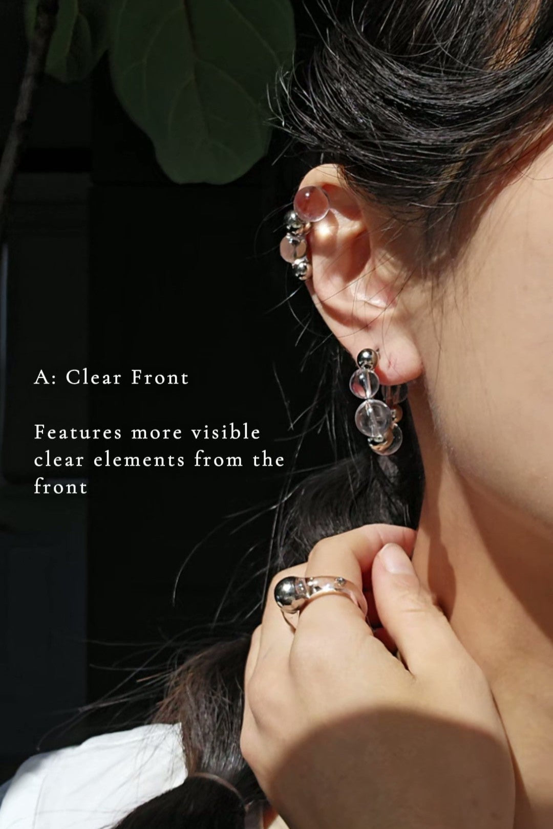 Model wearing GINRO hoop earring with clear orb facing front, for a soft, airy shimmer inspired by frozen dew