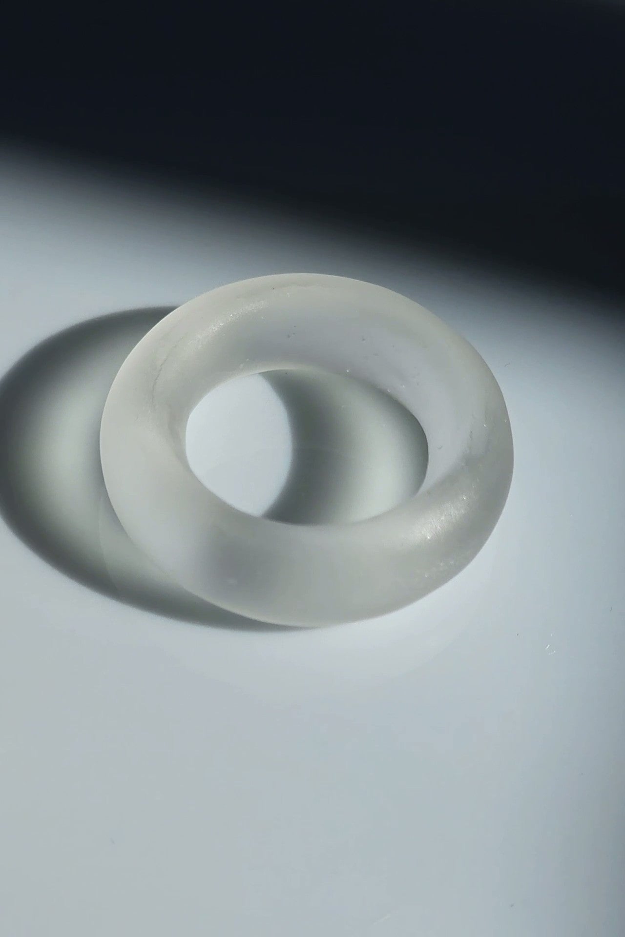 Close-up of KIRI ring showing frosty matte finish and calm, round silhouette.
