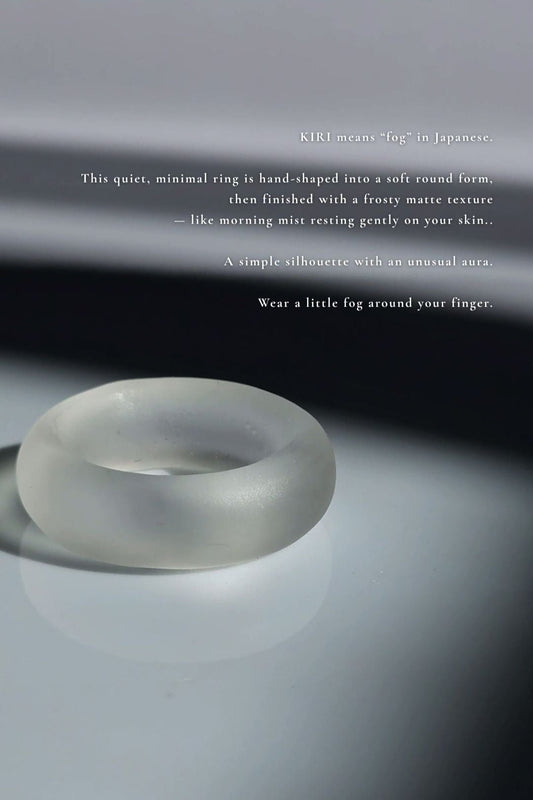 Close-up of KIRI round clear ring showing frosty matte finish and calm, round silhouette.
