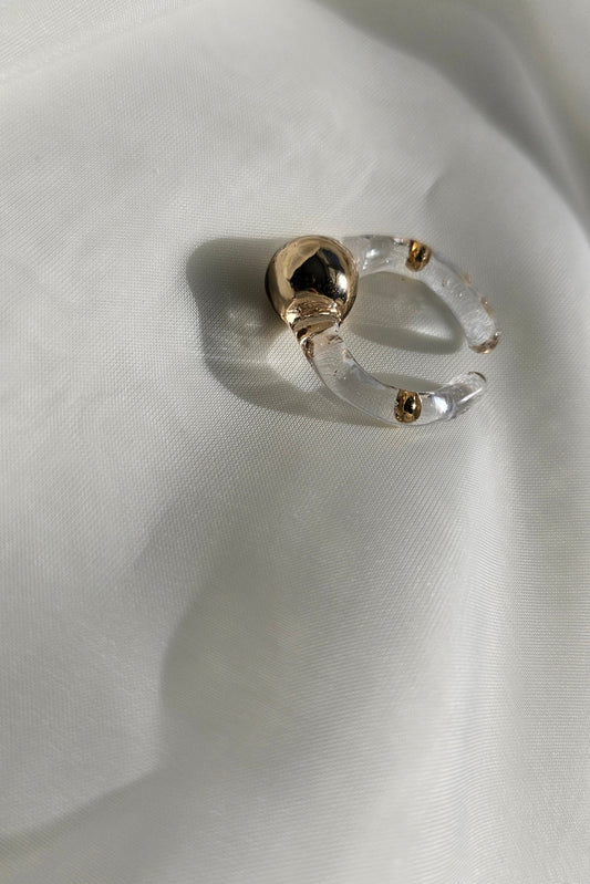 MITSUKI gold ring, a gold-orb ring with an intricate design, featuring a clear band and embedded gold orbs.