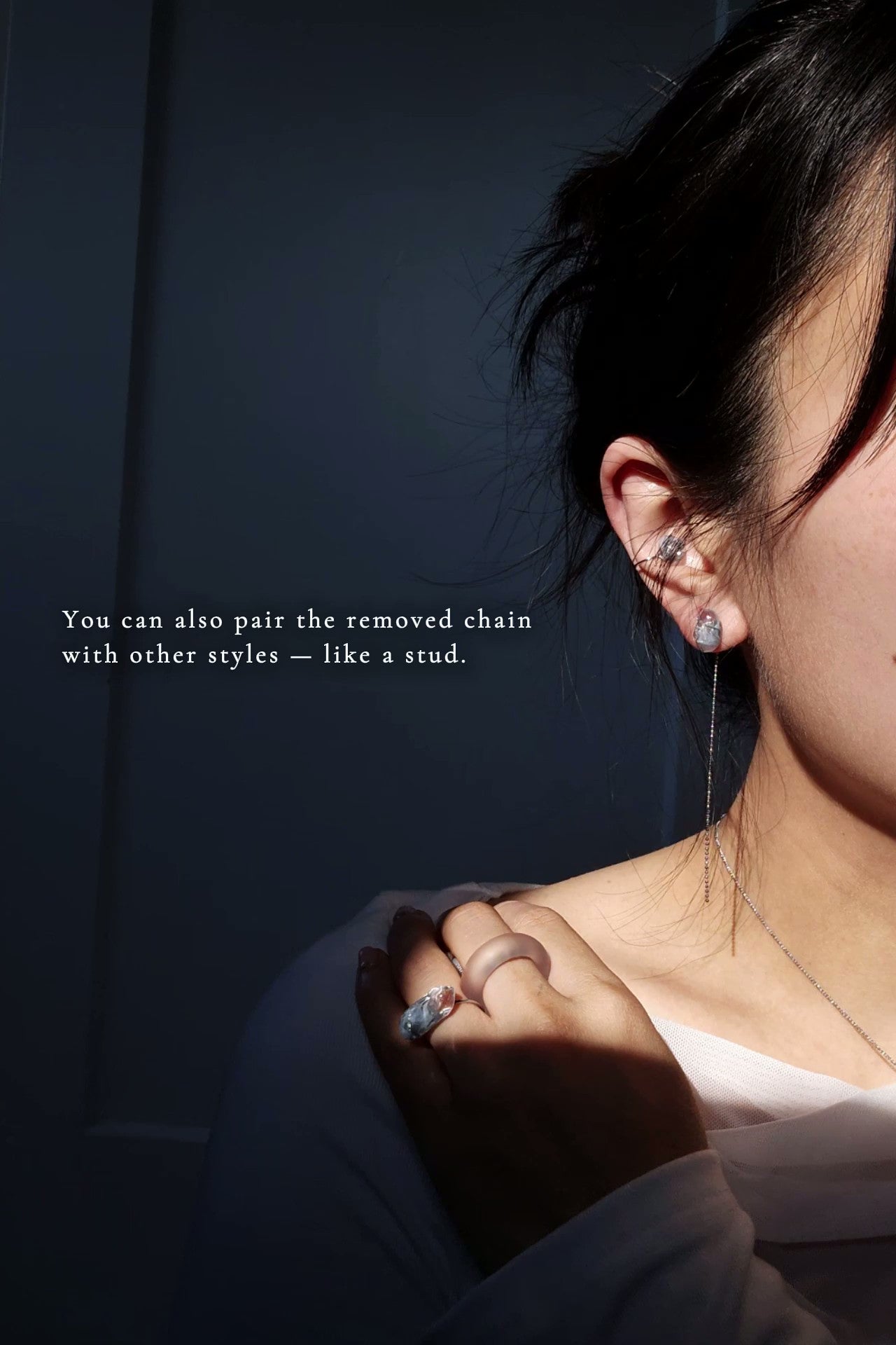 Model wearing NAMI multiway chain earcuff with the chain detached, paied with the stud from NAMI multiway drop with the detached chain.