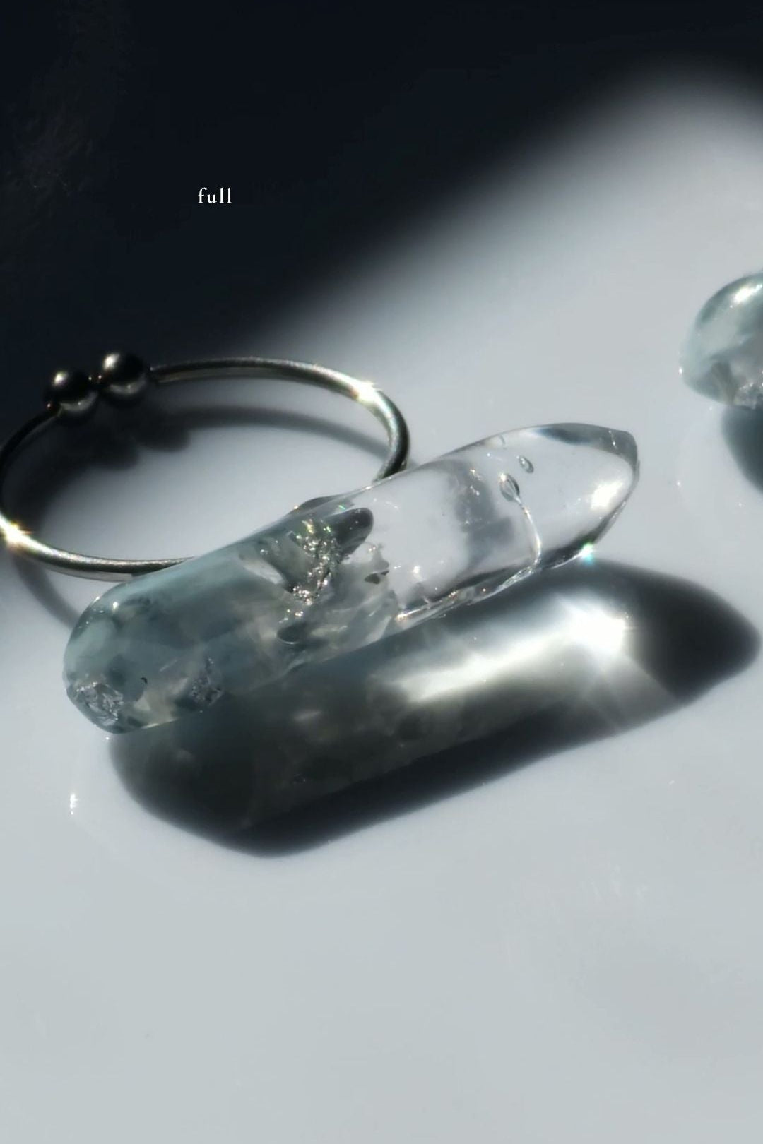 Handcrafted NAMI ring featuring blended gray and blue tones with fluid translucency, showing full size for bold styling.