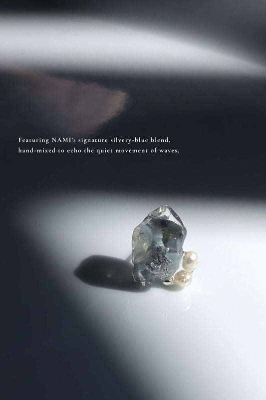 Close-up of the stud part from NAMI multiway short drop earring with pearls, silvery-blue stone.