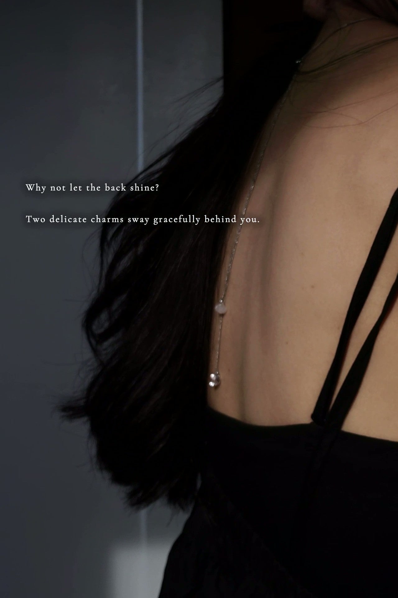REI silver multiway necklace is worn on a model with showcasing the two end chains draping on the back.