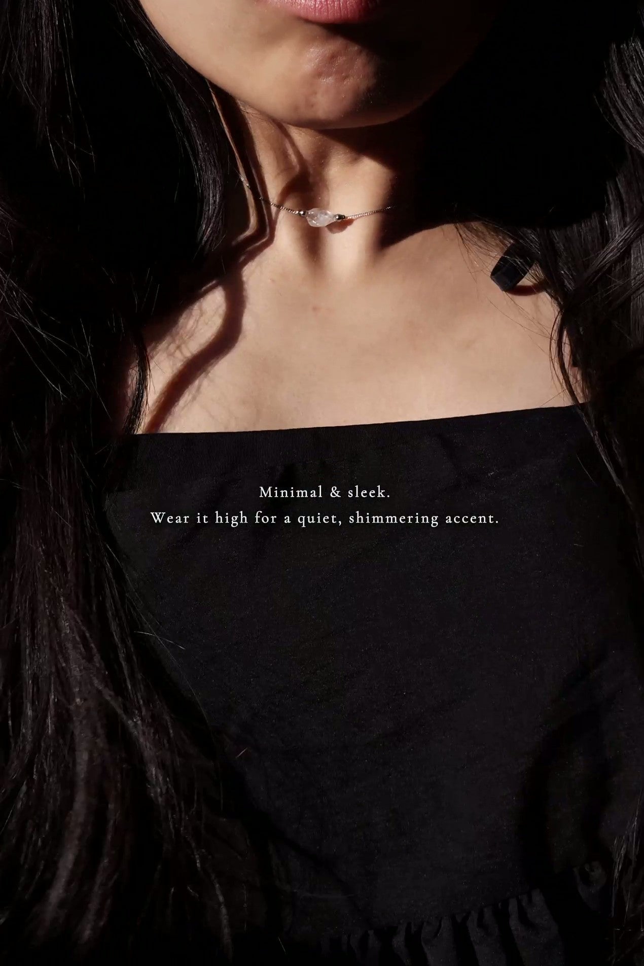REI silver multiway necklace is worn on a model as a choker style
