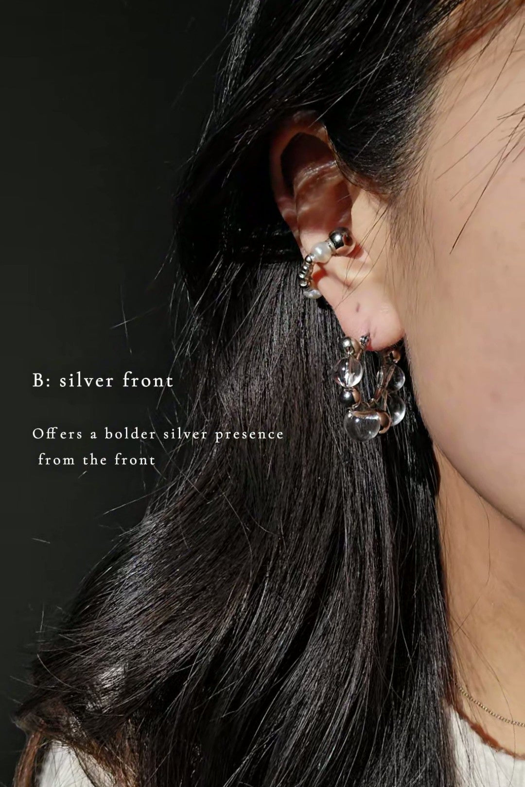 Model wearing GINRO hoop earring with silver orb facing front, for a bold yet elegant shine inspired by frozen dew.