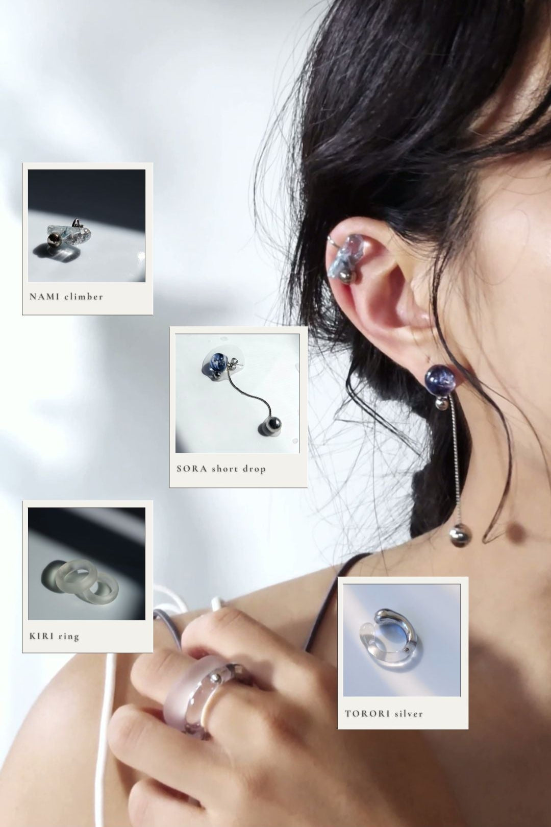 Model wearing NAMI climber fearing silvery blue grey stone with silver orb, pairedw with SORA short drop featuring hand-blended blue orb. KIRI frosty matte ring and TORORI silver ring on index finger.