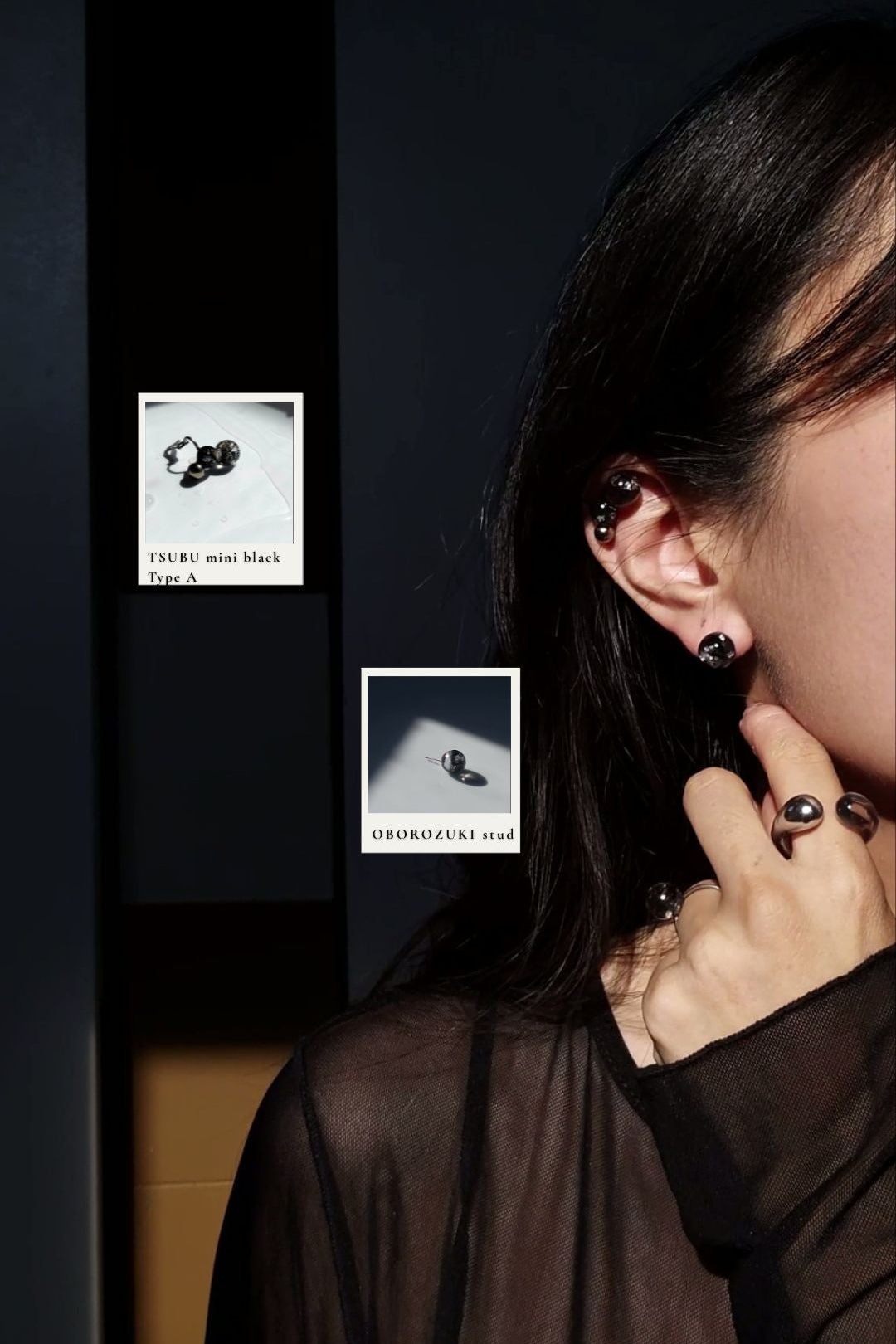 Model wearing TSUBU mini black on the helix with OBOROZUKI black stud on the earlobe