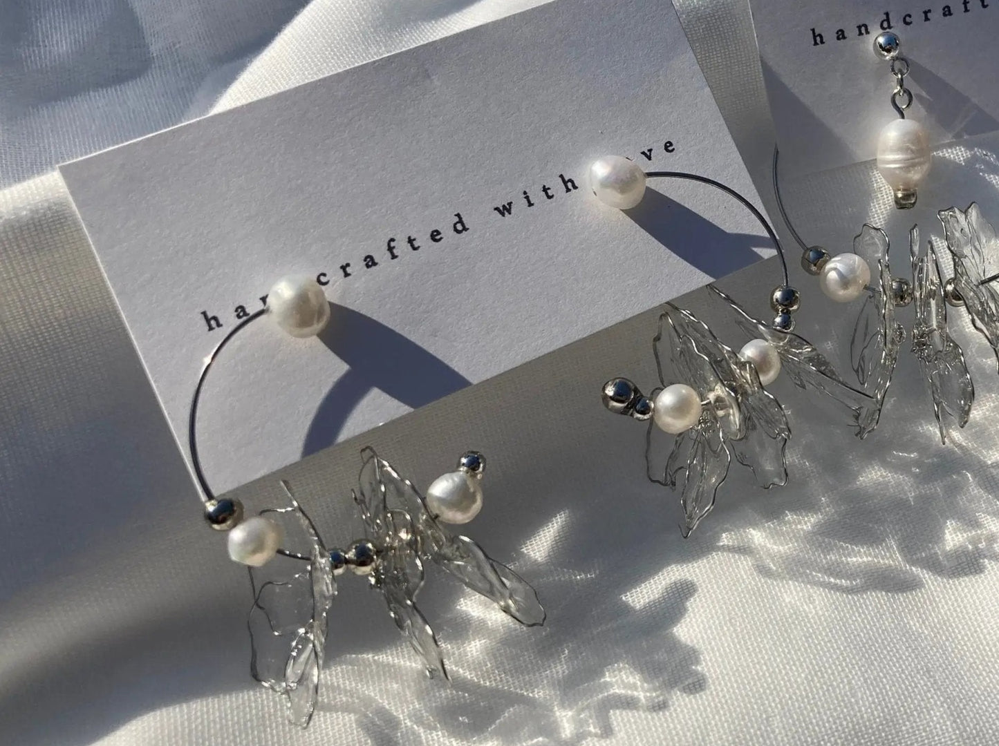 Rokka Clear Resin Petal & Freshwater Pearl Floral Earrings on Tag