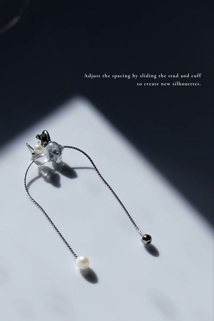 Handcrafted NAMI ear cuff and stud with chain and pearls, in fluid silvery-blue and gray tones, adjustable for different silhouettes.