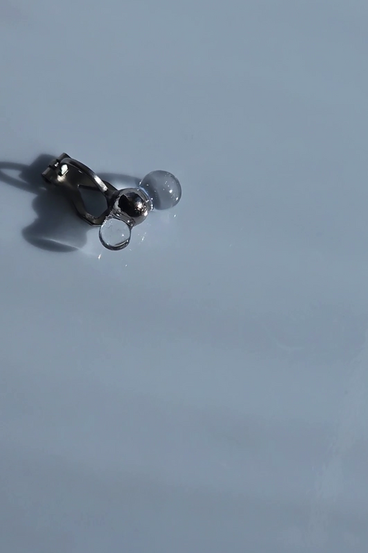 TSUBU micro fusion, clear orb and silver orb earcuff laid flat