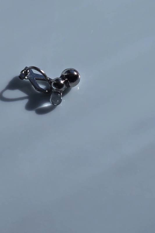 TSUBU micro ear cuff laid flat