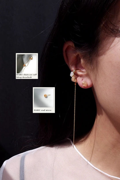 Model wearing HARU chain ear cuff and HARU stud micro, featuring hand-blended beige and oraneg stones. 
