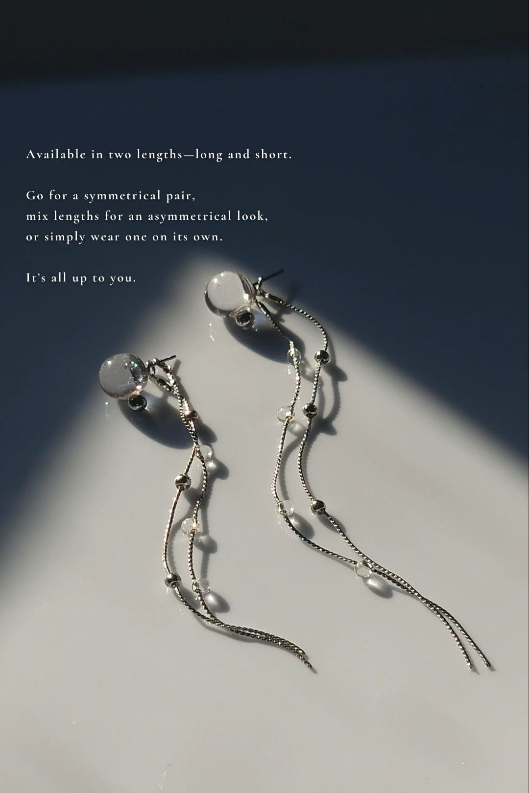 HISEN silver multiway drop earring with clear orb and silver chain strands, versatile as stud, drop, or dramatic style.