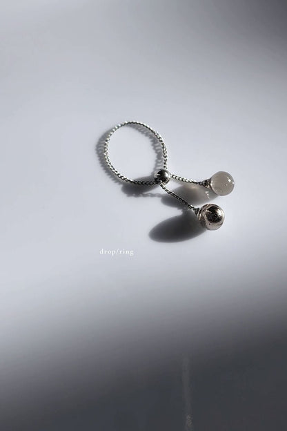 Silver chain ring with translucent black orb and silver orb, KAGE chain ring.