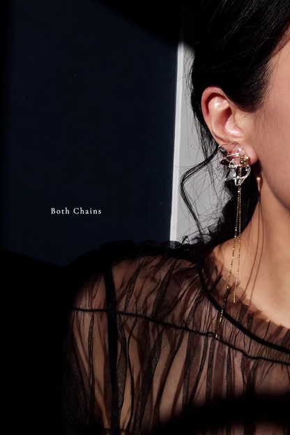 Model wearing gold clear floral earring, MEIKA gold chain drop.