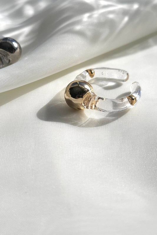 MITSUKI gold ring, a gold-orb ring with an intricate design, featuring a clear band and embedded gold orbs.