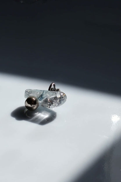 NAMI ear climber with hand-molded silvery blue-gray stone and silver orb, inspired by waves.