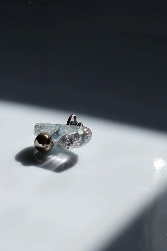 NAMI ear climber with hand-molded silvery blue-gray stone and silver orb, inspired by waves.