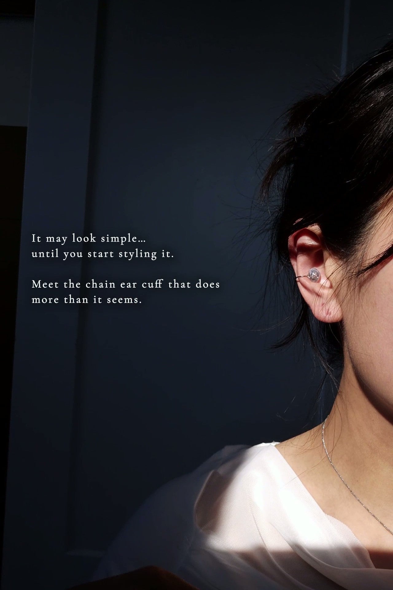 Model wearing NAMI multiway chain ear cuff with the chain detached, featuring hand-blended silvery-blue stone.
