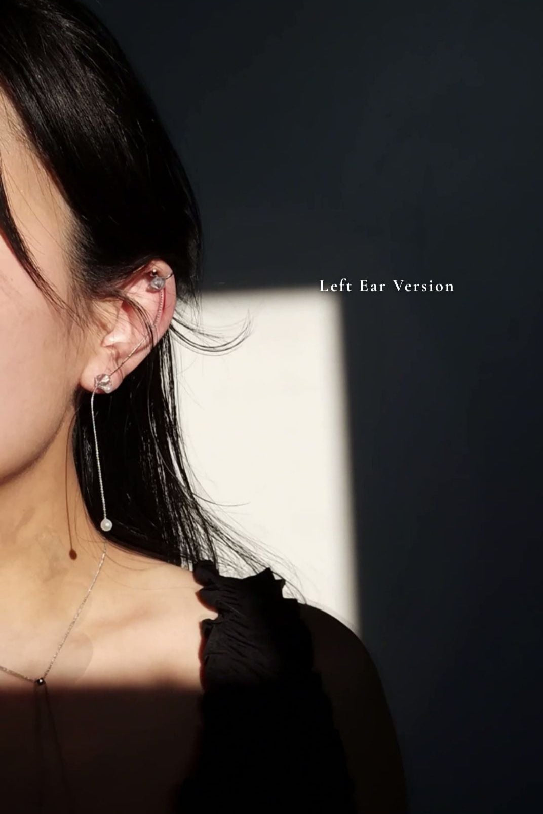 Model wearing NAMI multiway cuff & stud on earlobe with the chain hanging on a left ear.