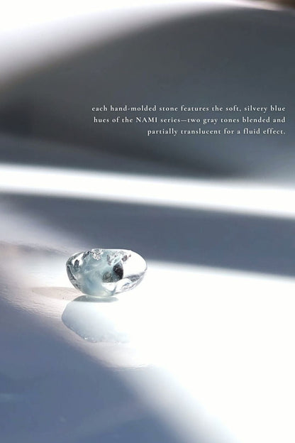 Close-up of the stud part from NAMI multiway drop earring with adjustable chain and pearl, silvery-blue wave-inspired design.