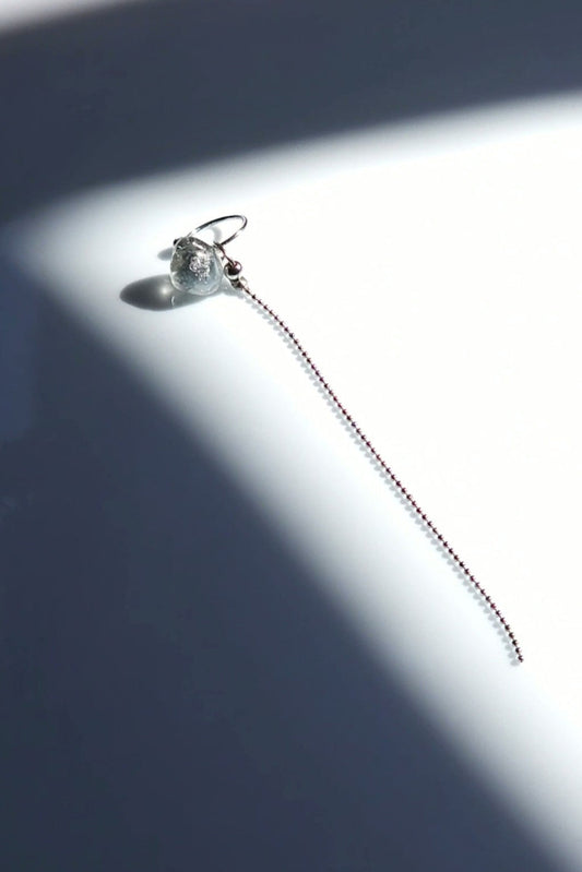 NAMI multiway chain ear cuff with hand-molded silvery-blue stone and detachable chain, inspired by ocean waves, sculptural yet delicate.