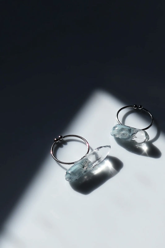 NAMI ring with hand-mixed silvery blue and gray translucent tones, inspired by ocean waves, shown in both mini and full sizes for stacking or solo wear.
