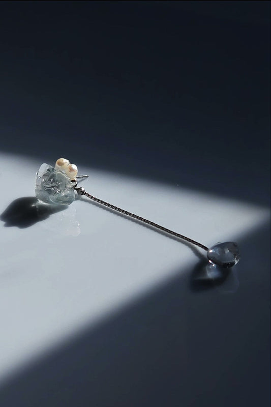 NAMI multiway short drop stud earring with silvery-blue hand-molded stone, freshwater pearls, and detachable clear stone chain, inspired by ocean waves.