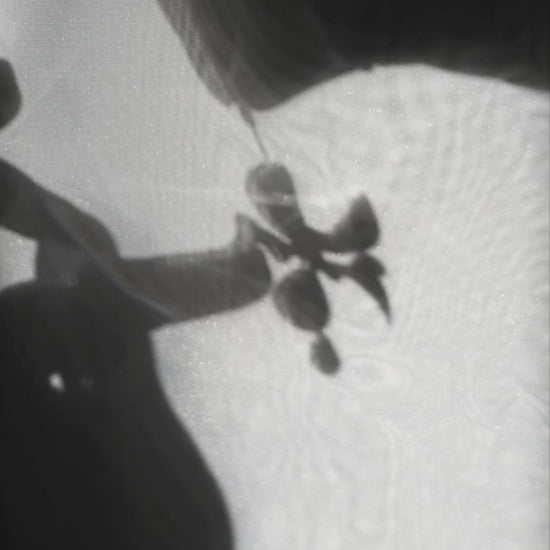 Model showcasing how multiway clear floral drop earring, MEIKA gold short drop, works.