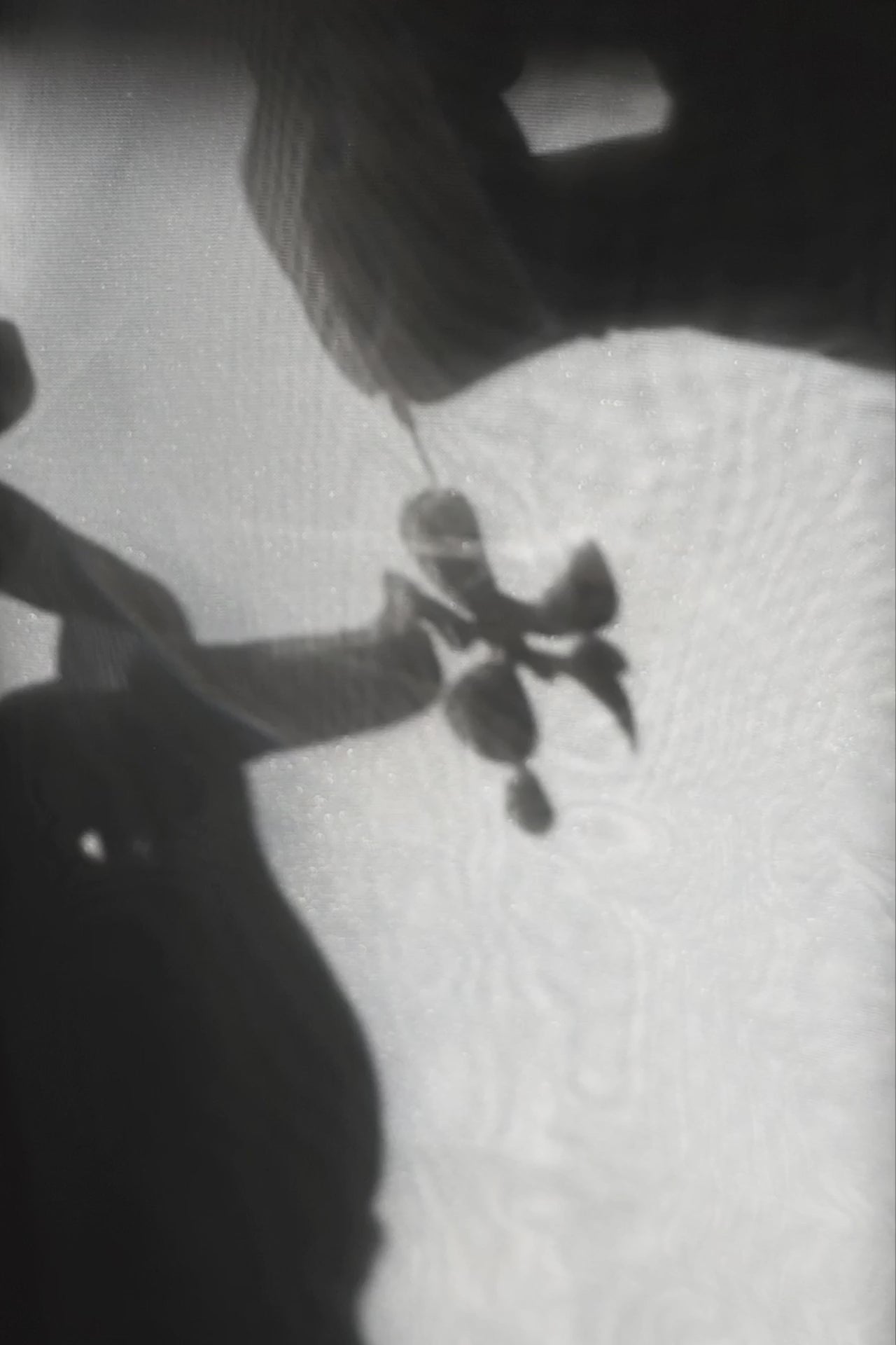 Model showcasing how multiway clear floral drop earring, MEIKA gold short drop, works.