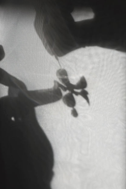 Model showcasing how multiway clear floral drop earring, MEIKA gold short drop, works.