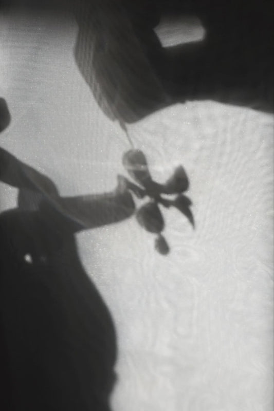 Model showcasing how multiway clear floral drop earring, MEIKA gold short drop, works.