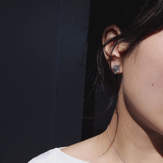 Video of explaining how NAMI multiway short drop stud earring with silvery-blue hand-molded stone, freshwater pearls, and detachable clear stone chain, transform.