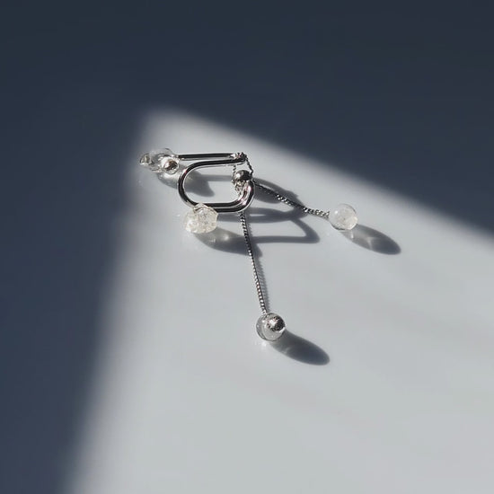 REI multiway ear cuff and ring set shown detached with adjustable chain, clear and melting ice stones, and slide ball for customizable styling.