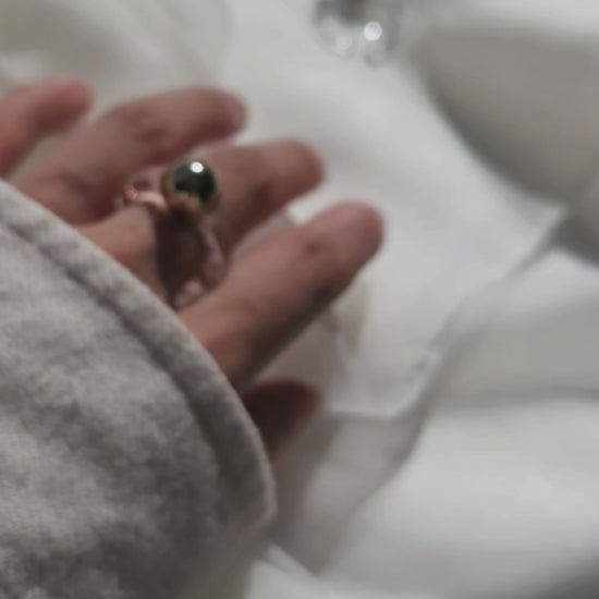 Video of MITSUKI gold ring, a gold-orb ring with an intricate design, featuring a clear band and embedded gold orbs.