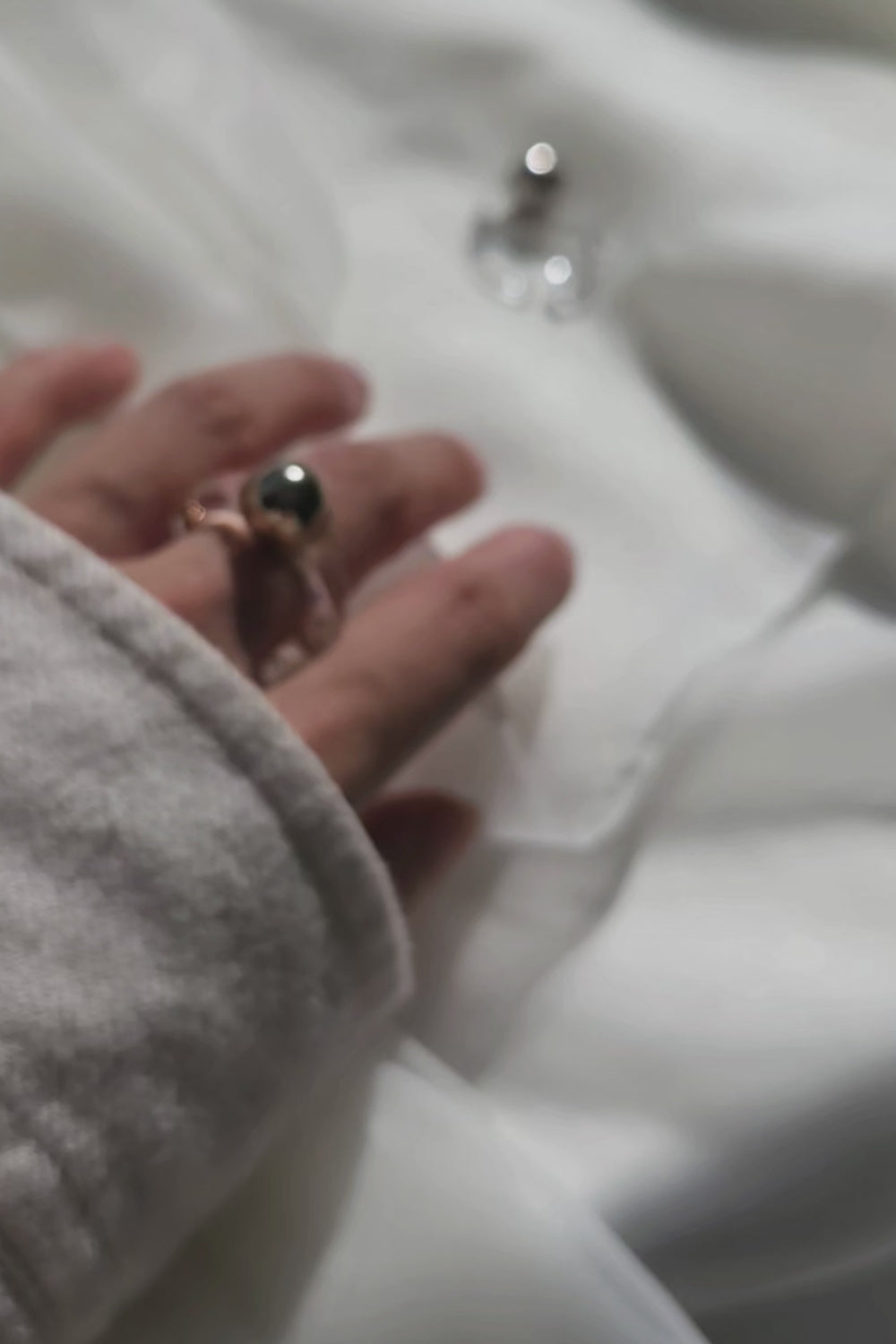 Video of MITSUKI gold ring, a gold-orb ring with an intricate design, featuring a clear band and embedded gold orbs.