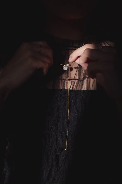 REI gold / orb necklace