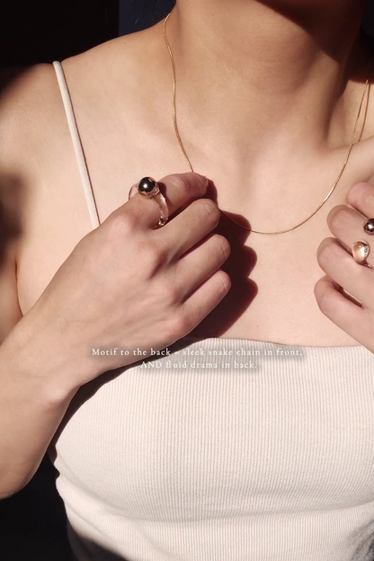 REI gold / tie necklace - triangle