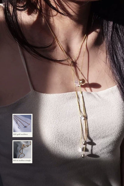 REI gold / tie necklace - triangle