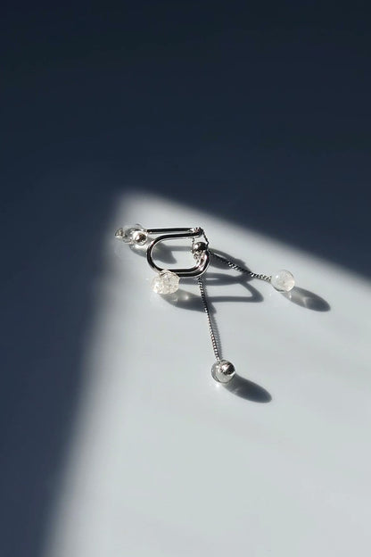 REI multiway ear cuff and ring set shown with detachable chain ring, clear and melting ice stones, and slide ball for customizable styling.