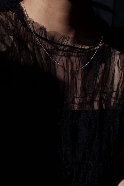 REI silver / orb necklace