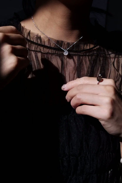 REI silver / orb necklace