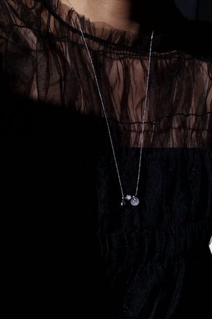 REI silver / orb necklace