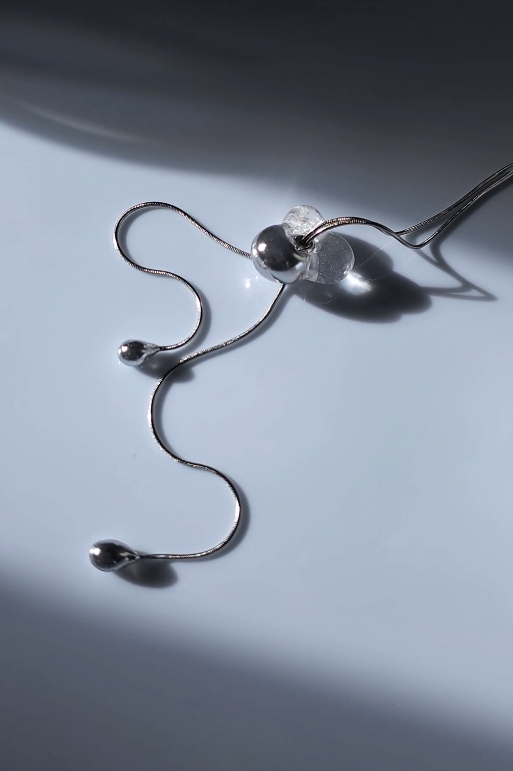 REI silver / tie necklace - triangle