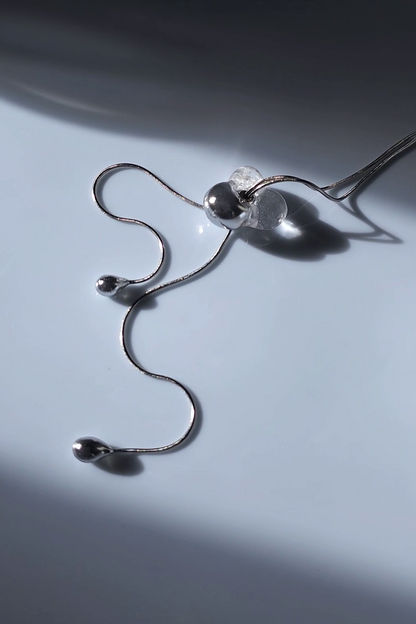REI silver / tie necklace - triangle