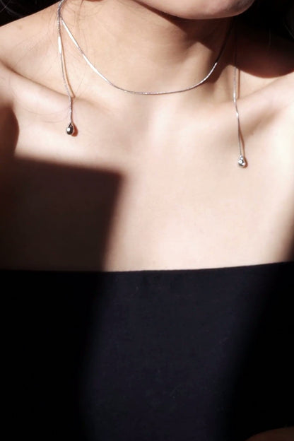 REI silver / tie necklace - triangle