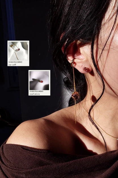 Model wearing gold chain ear cuff with orb drop in dark cherry, SAKURAMBO chain ear cuff, paird with a 6mm stud in dark cherry, SAKURAMBO micro stud.