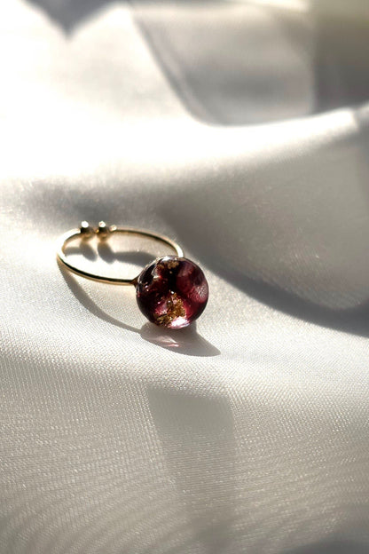 10mm orb ring in dark cherry, SAKURAMBO ring on a flat surface.